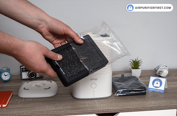 Prepare a new filter and place it inside the air purifier.